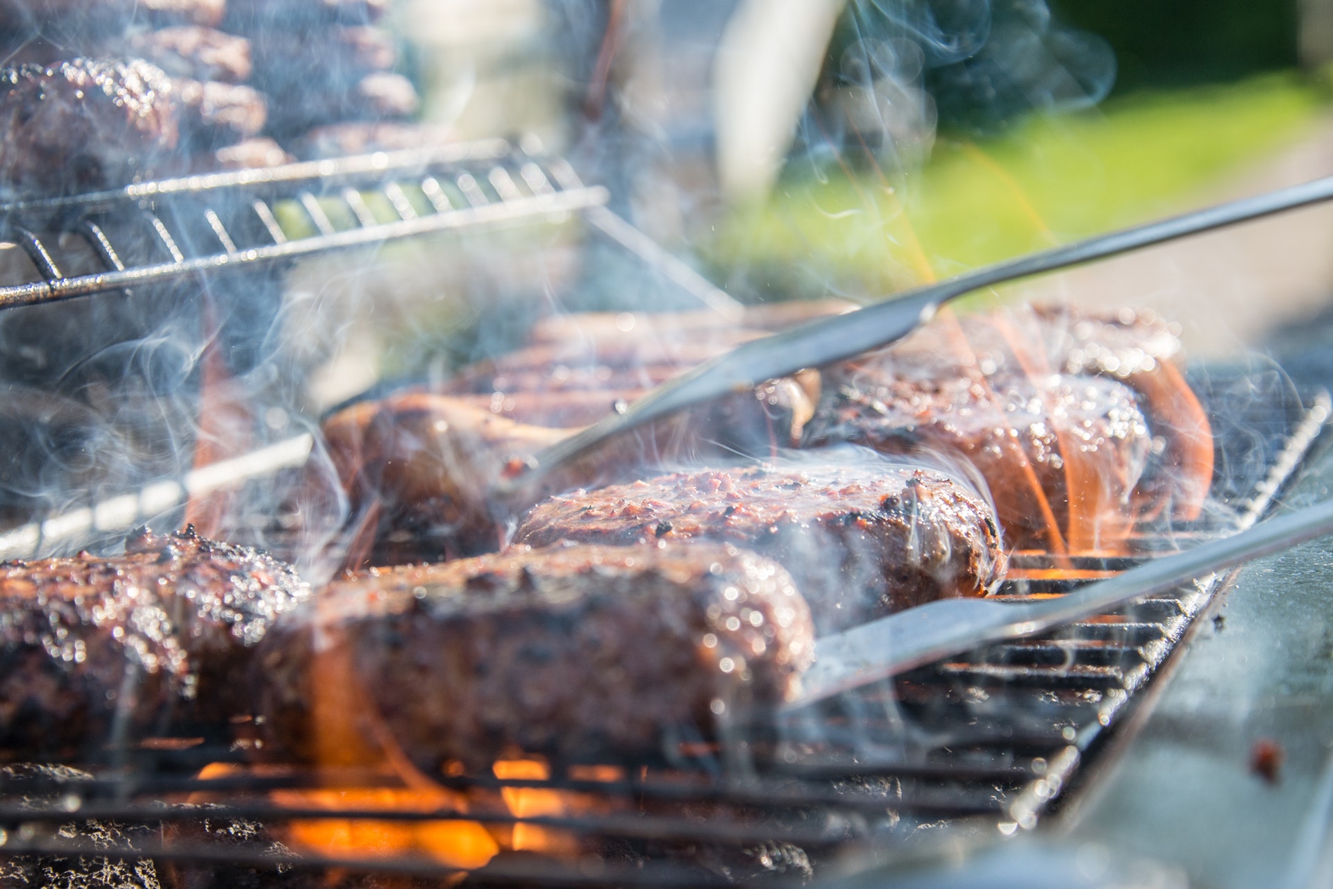 Beef cooking on the grill.